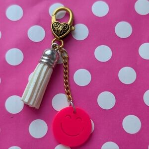 Gold and Pink Smiley Bag Charm with White Tassel